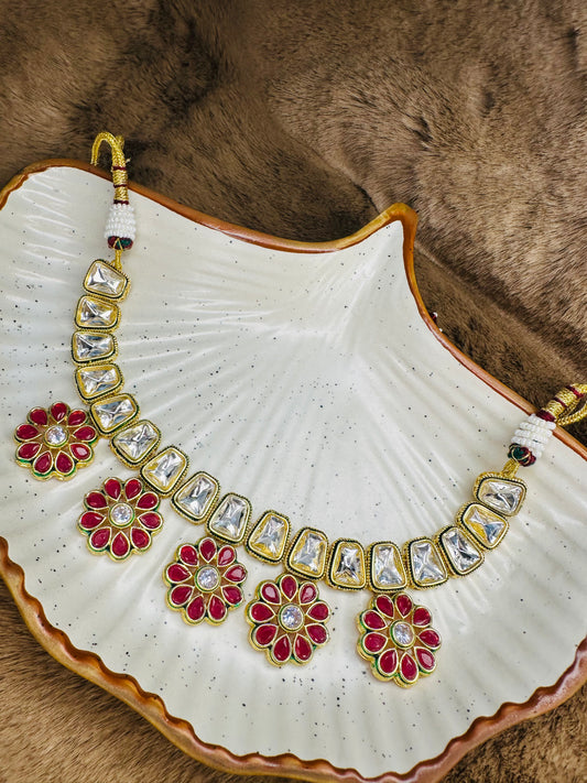 Necklace set with earrings on plate