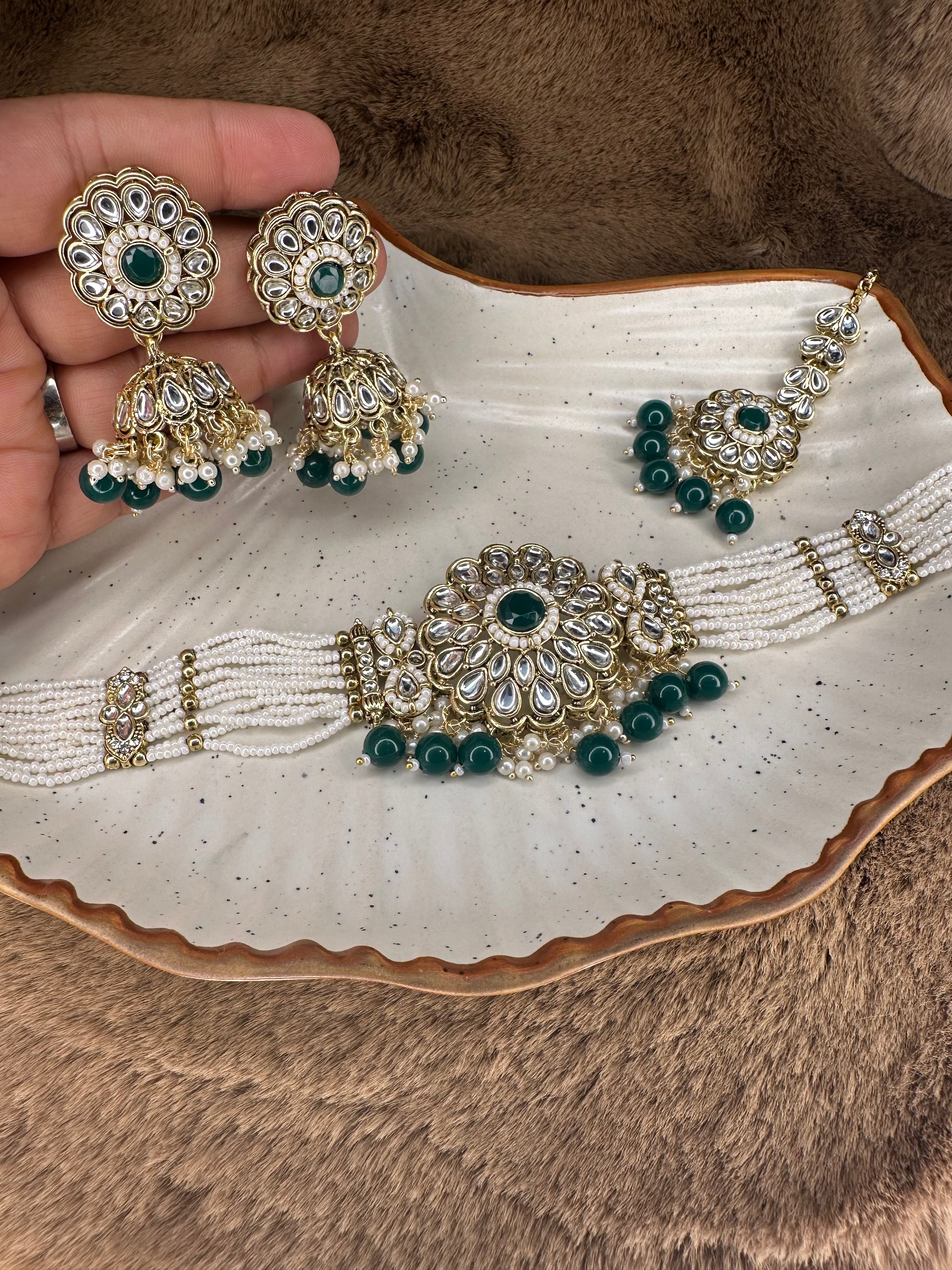 Intricate gold detailing with red Kundan stones & pearls