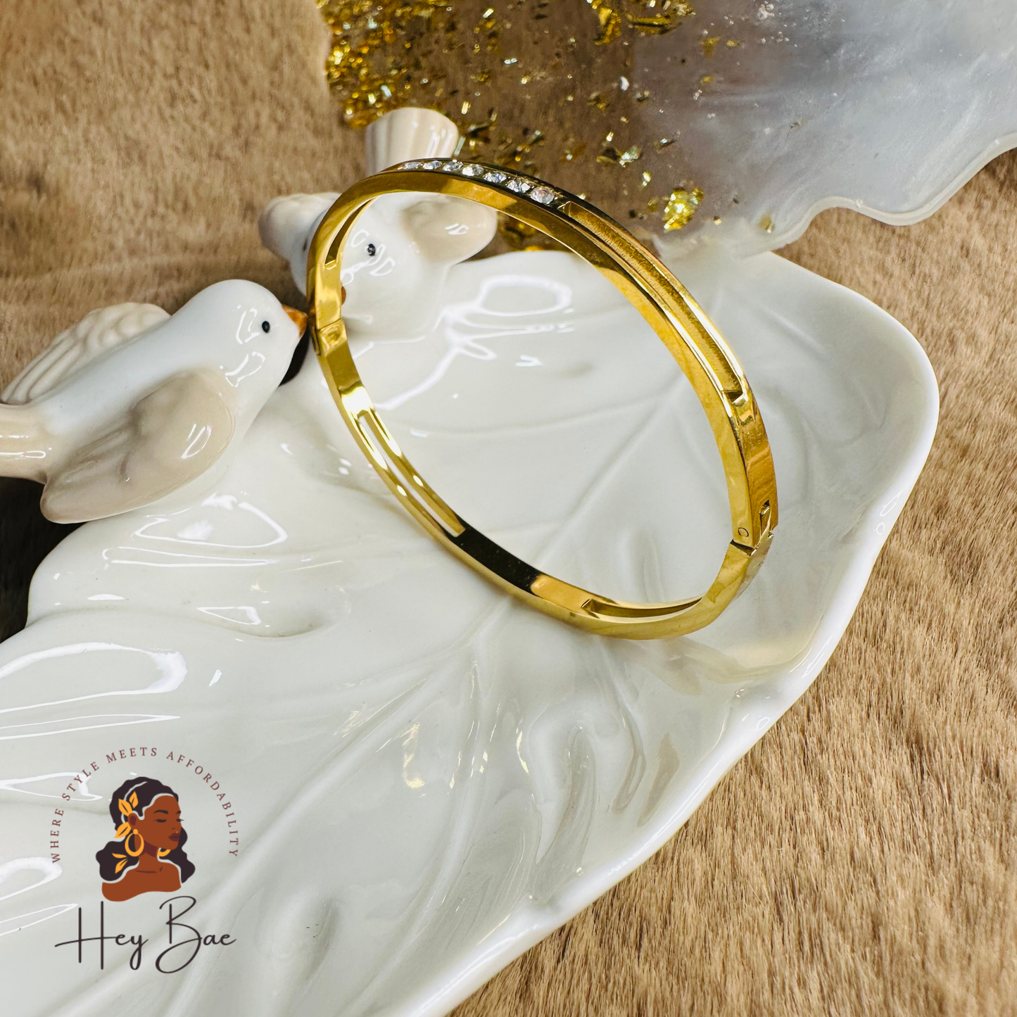 Side angle view of HeyBae Elegant AD Sleek Bracelet in gold-plated finish