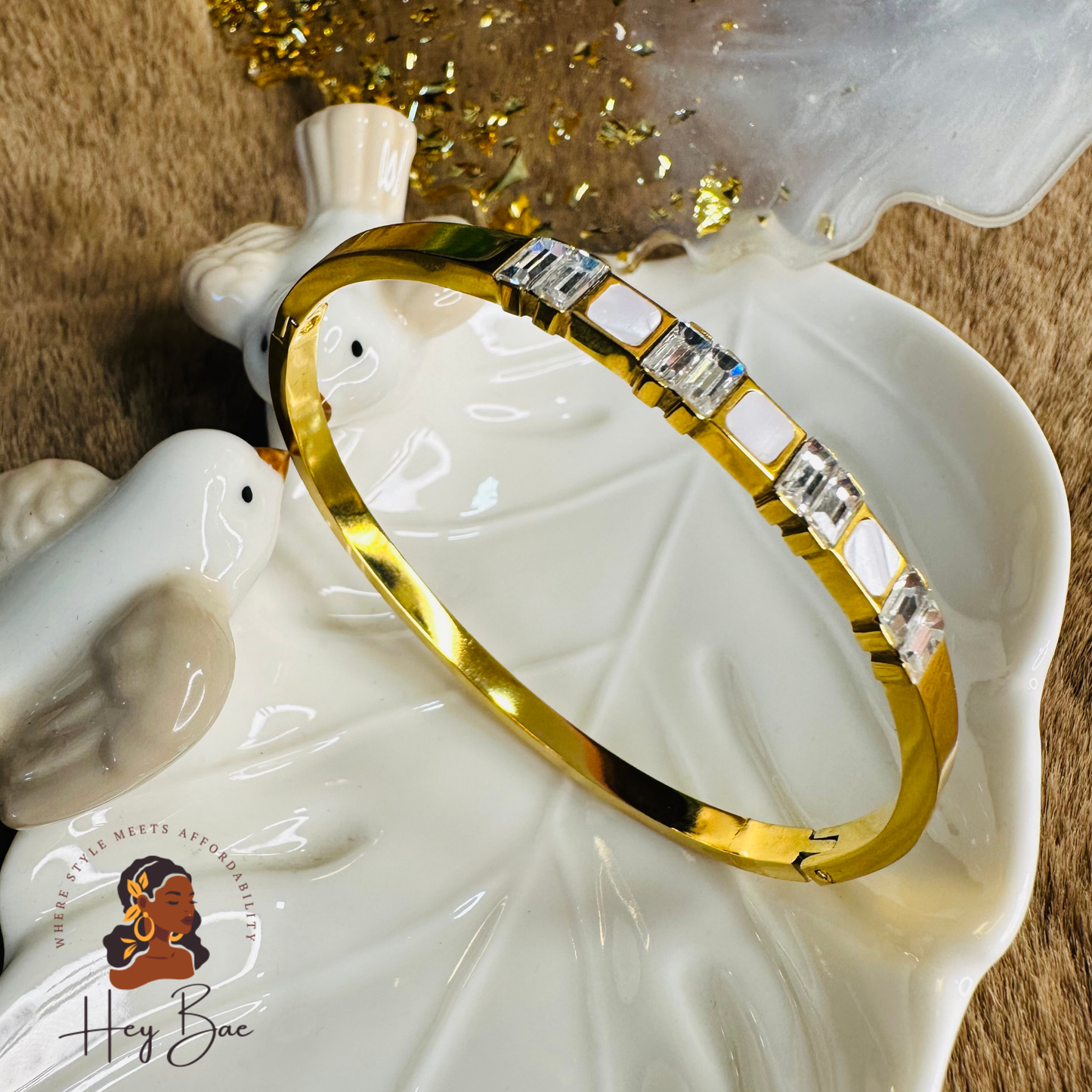 Side angle view of HeyBae AD Studded Gold Bangle with matte gold finish