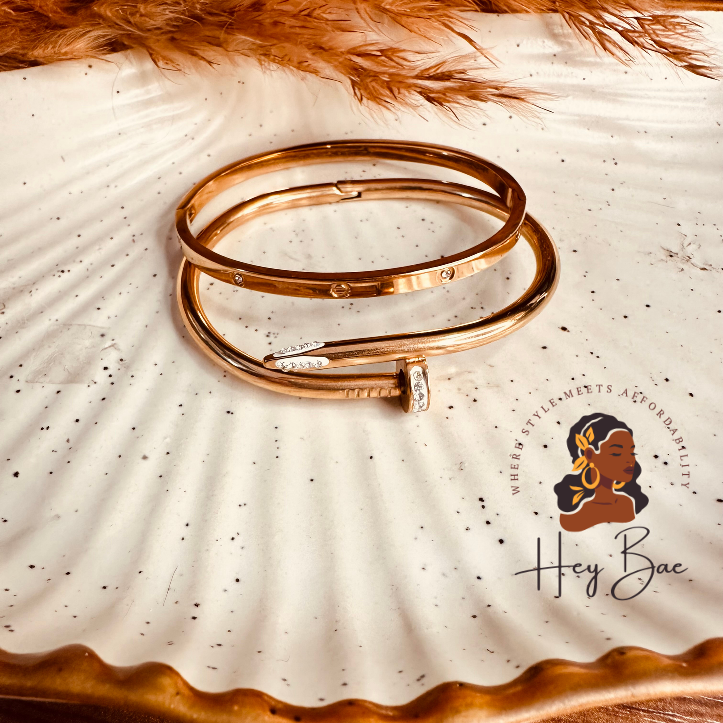 Flat lay display of HeyBae Anti-Tarnish Love Band & Nail Cuff Bracelet Set