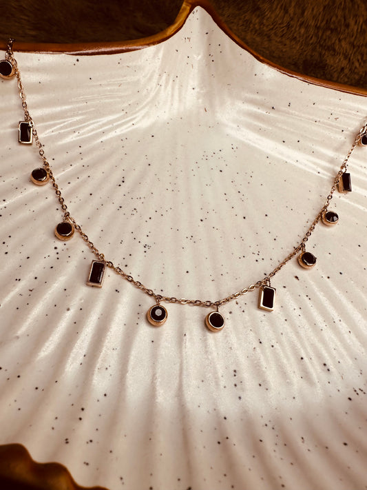 Close-up of HeyBae Stainless Steel Charm Pendant Necklace in Gold, Black & White