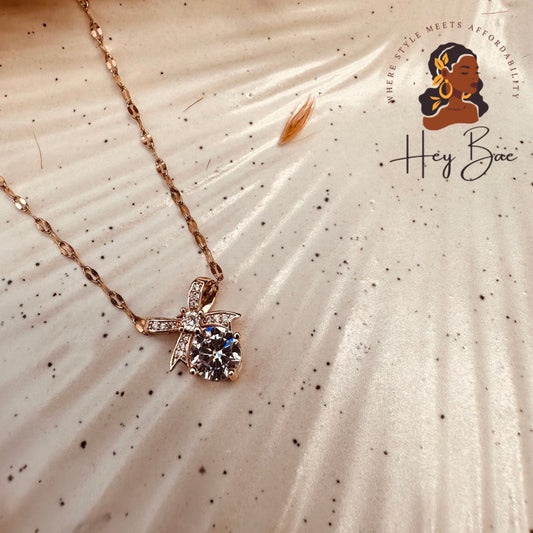 Side angle of HeyBae Solitaire Crystal Bow Pendant Chain Set