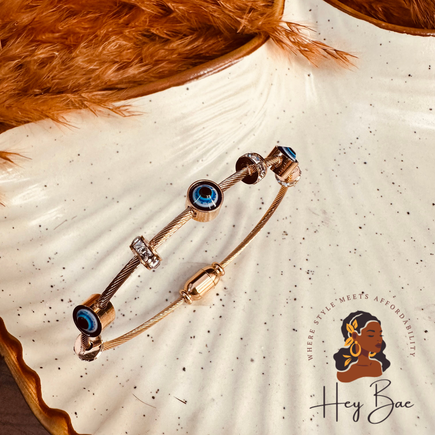 Flat lay of HeyBae Anti-Tarnish Evil Eye Rose Gold Bracelet with magnetic clasp