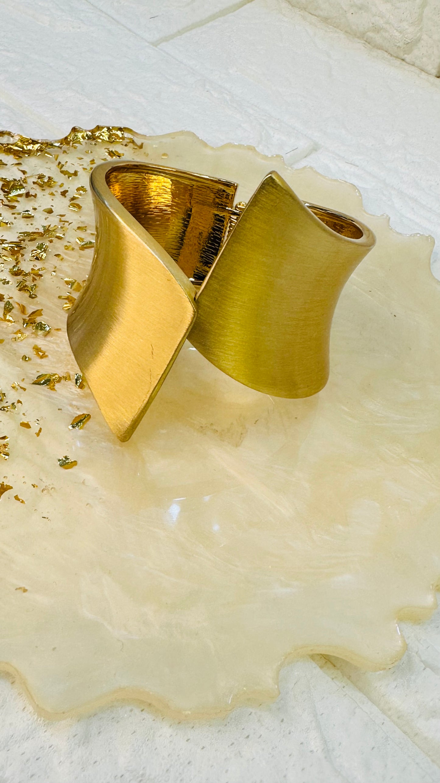Geometric gold cuff bracelet displayed in HeyBae premium gift jewelry