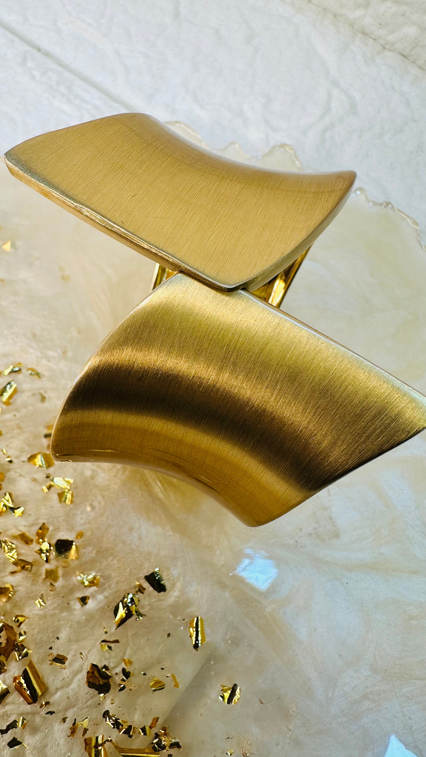 Geometric gold cuff bracelet styled on hand for festive and party wear