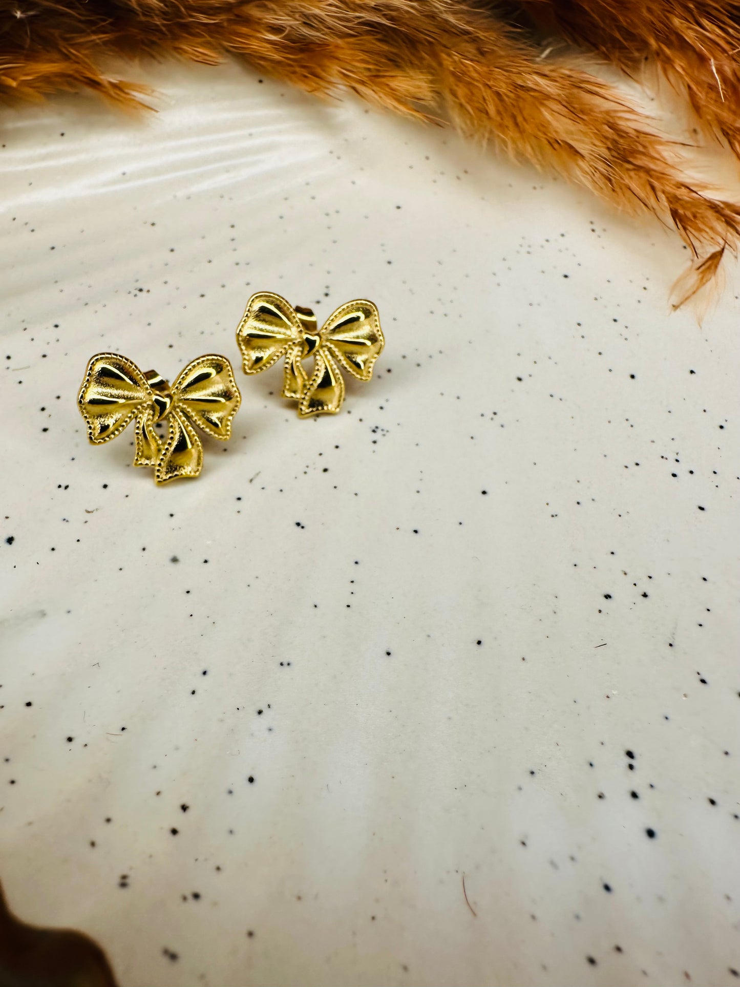 HeyBae gold bow stud earrings for women with elegant design
