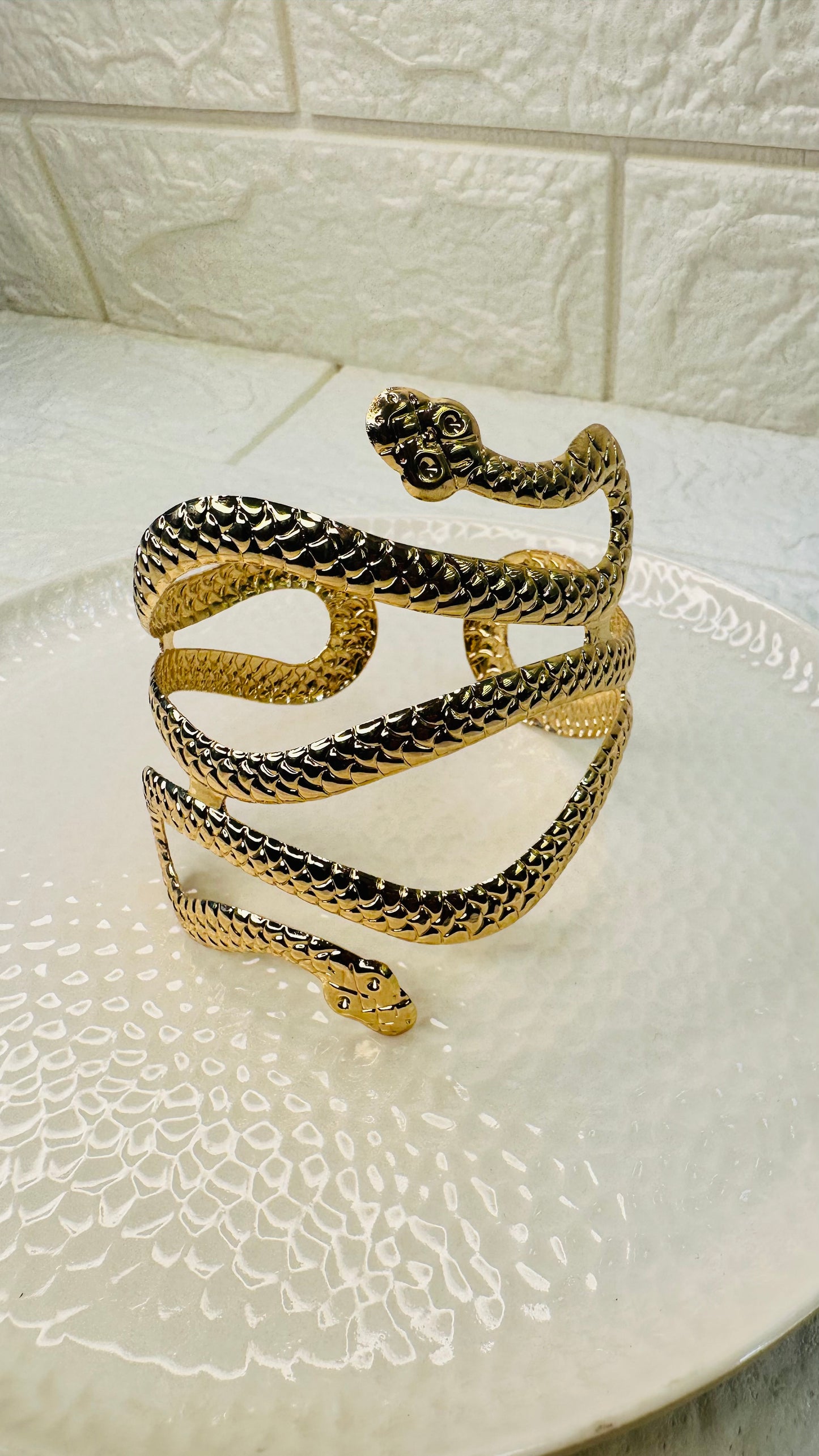 Gold snake cuff bracelet paired with saree and lehenga for ethnic look