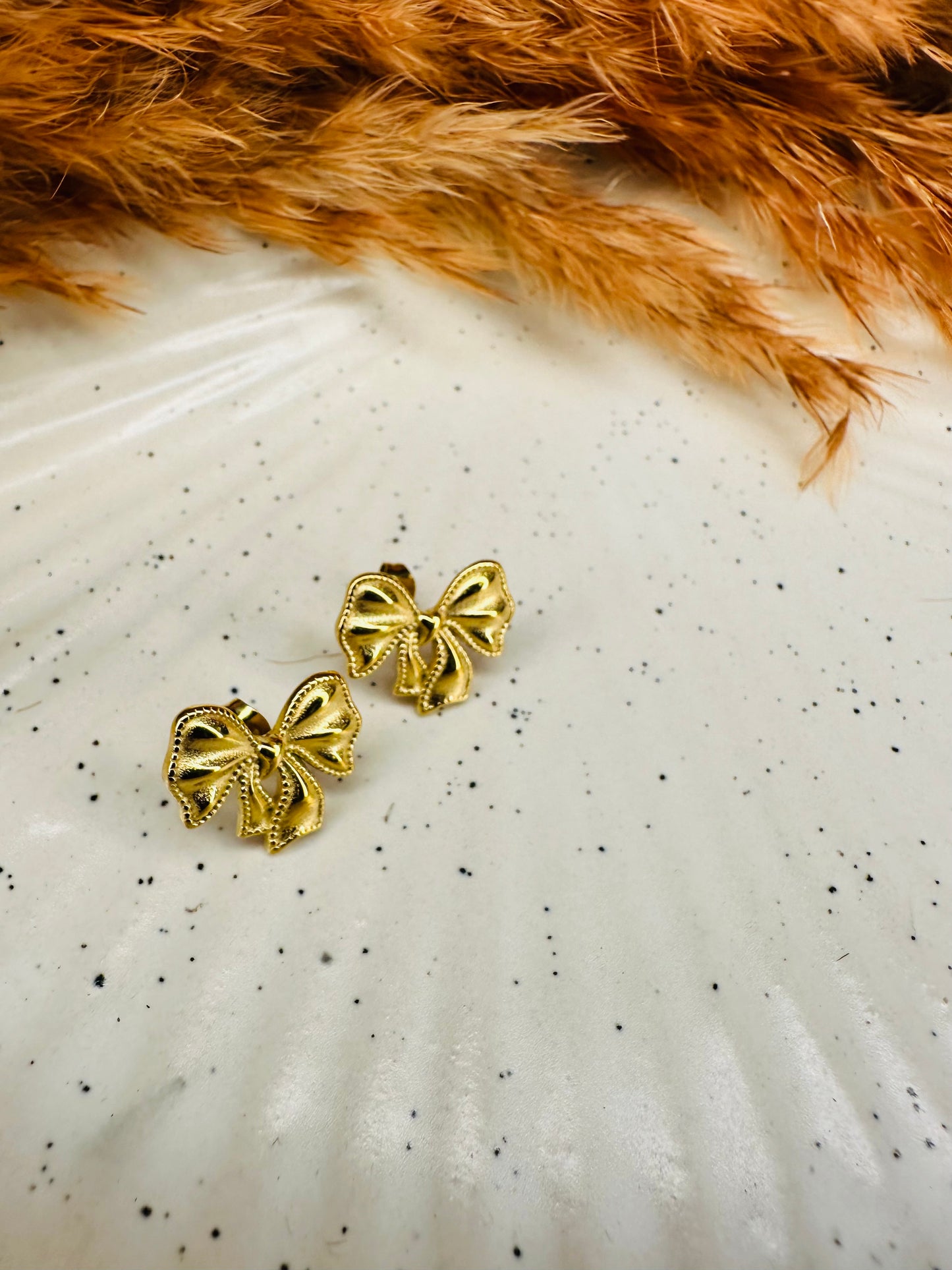Lightweight womenโs gold bow earrings for daily wear
