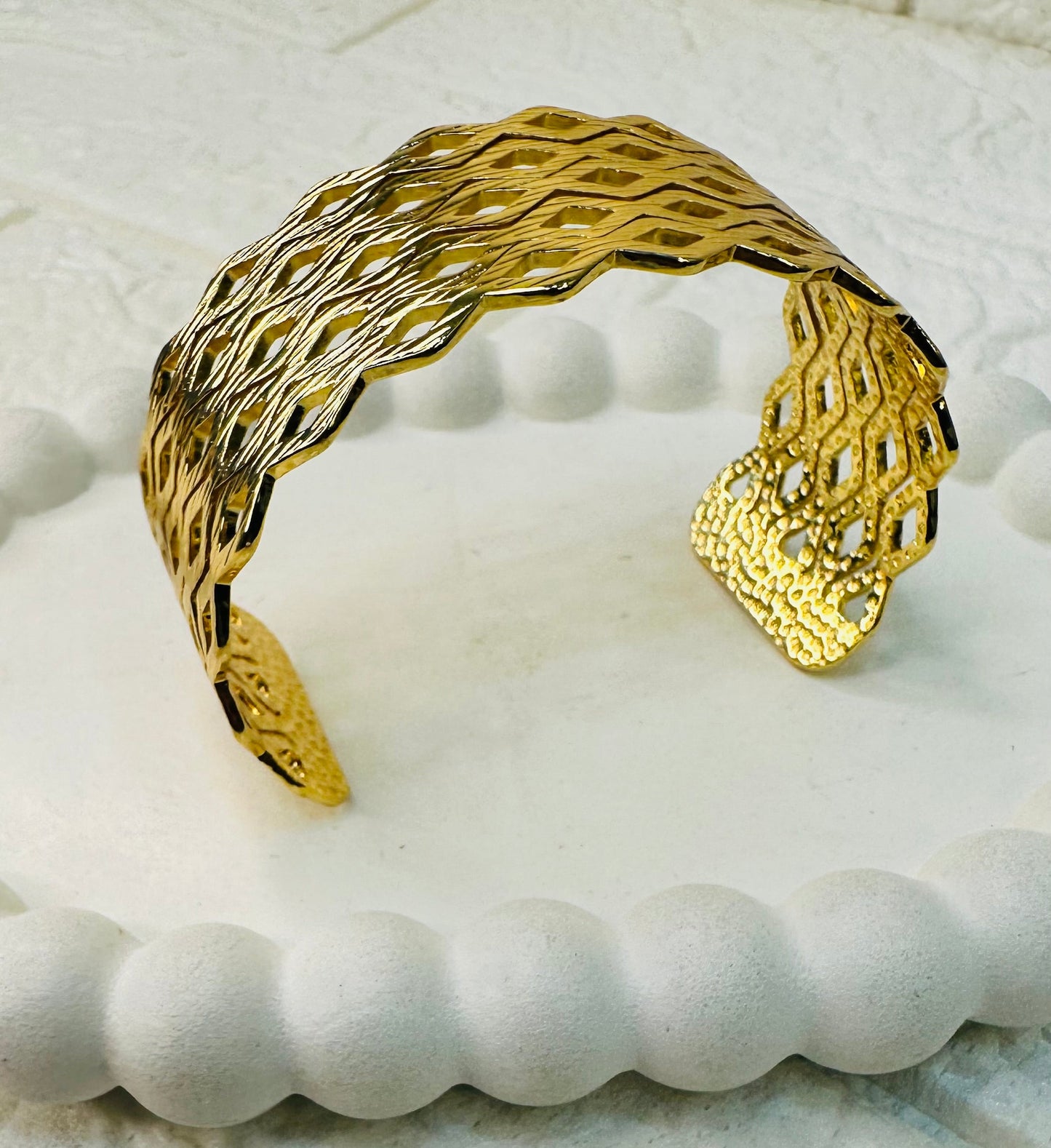 Festive gold bracelet with open cut geometric style