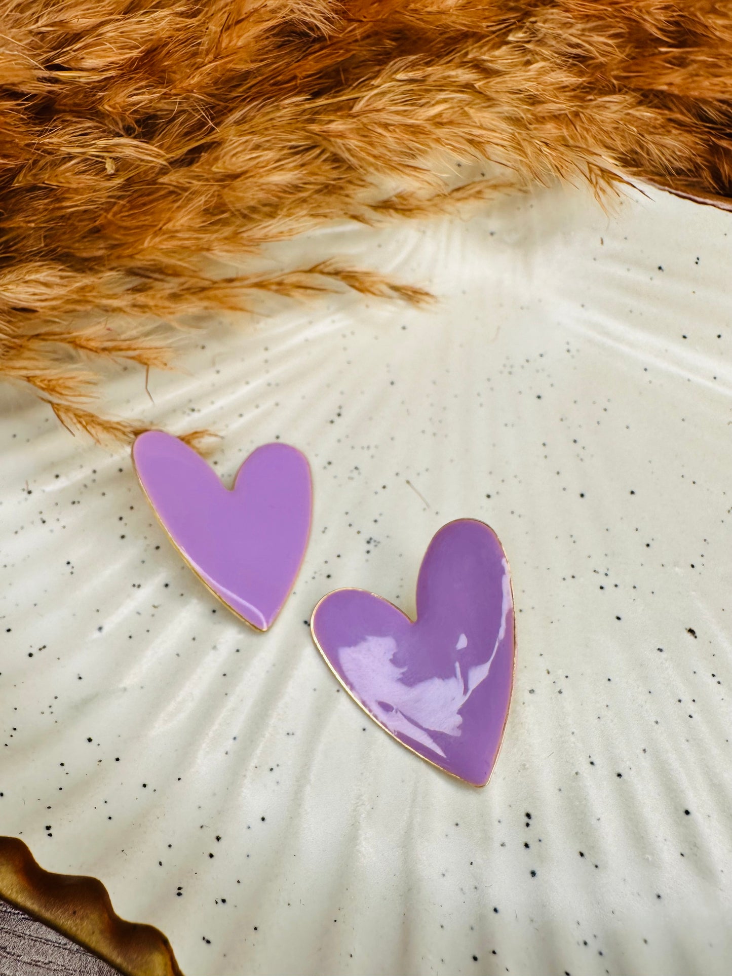 Close-up of HeyBae Purple Heart Earrings with Glossy Finish and Bold Design