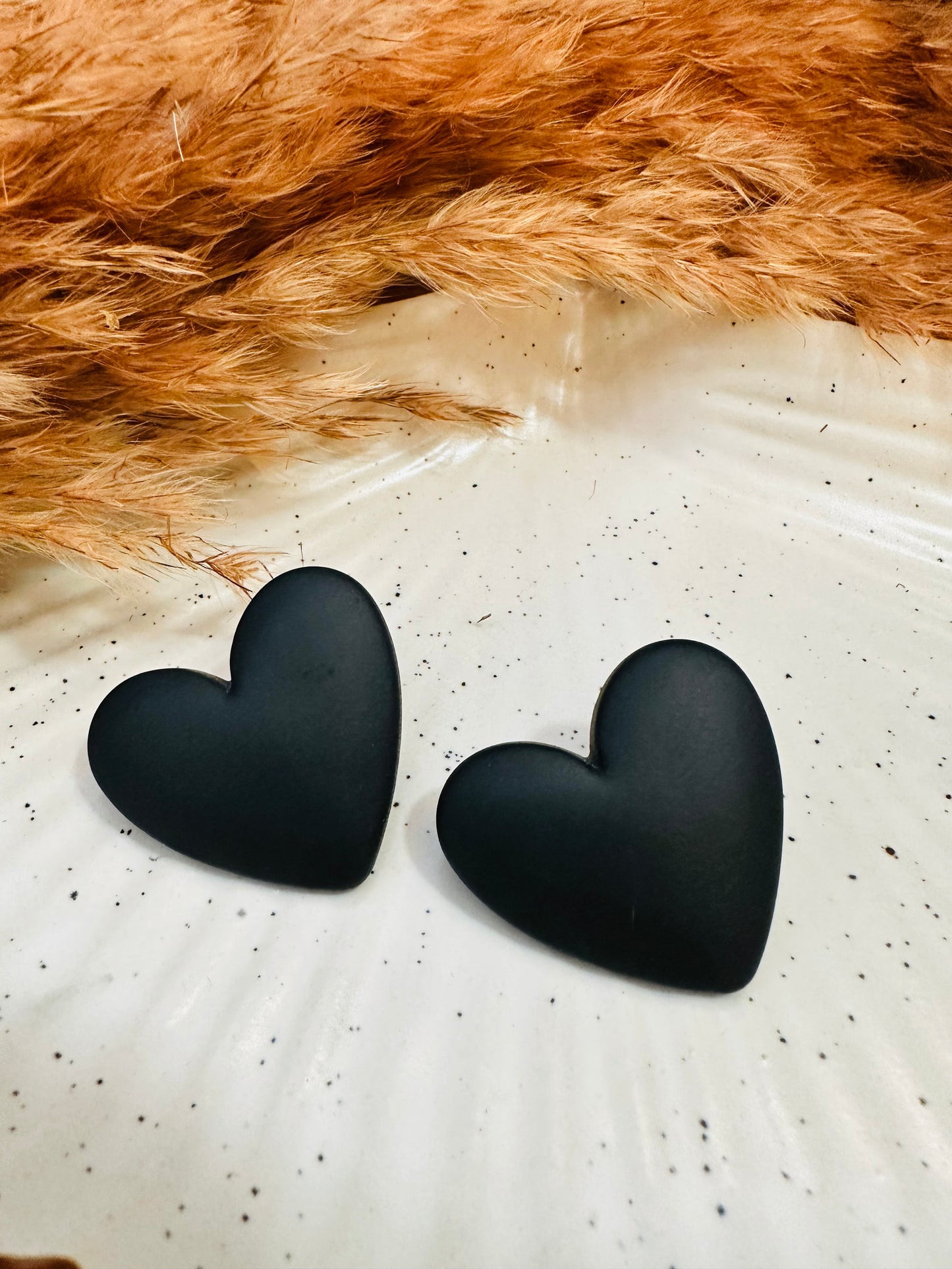 Close-up Detailing of HeyBae Purple Heart Statement Earrings with Glossy Finish