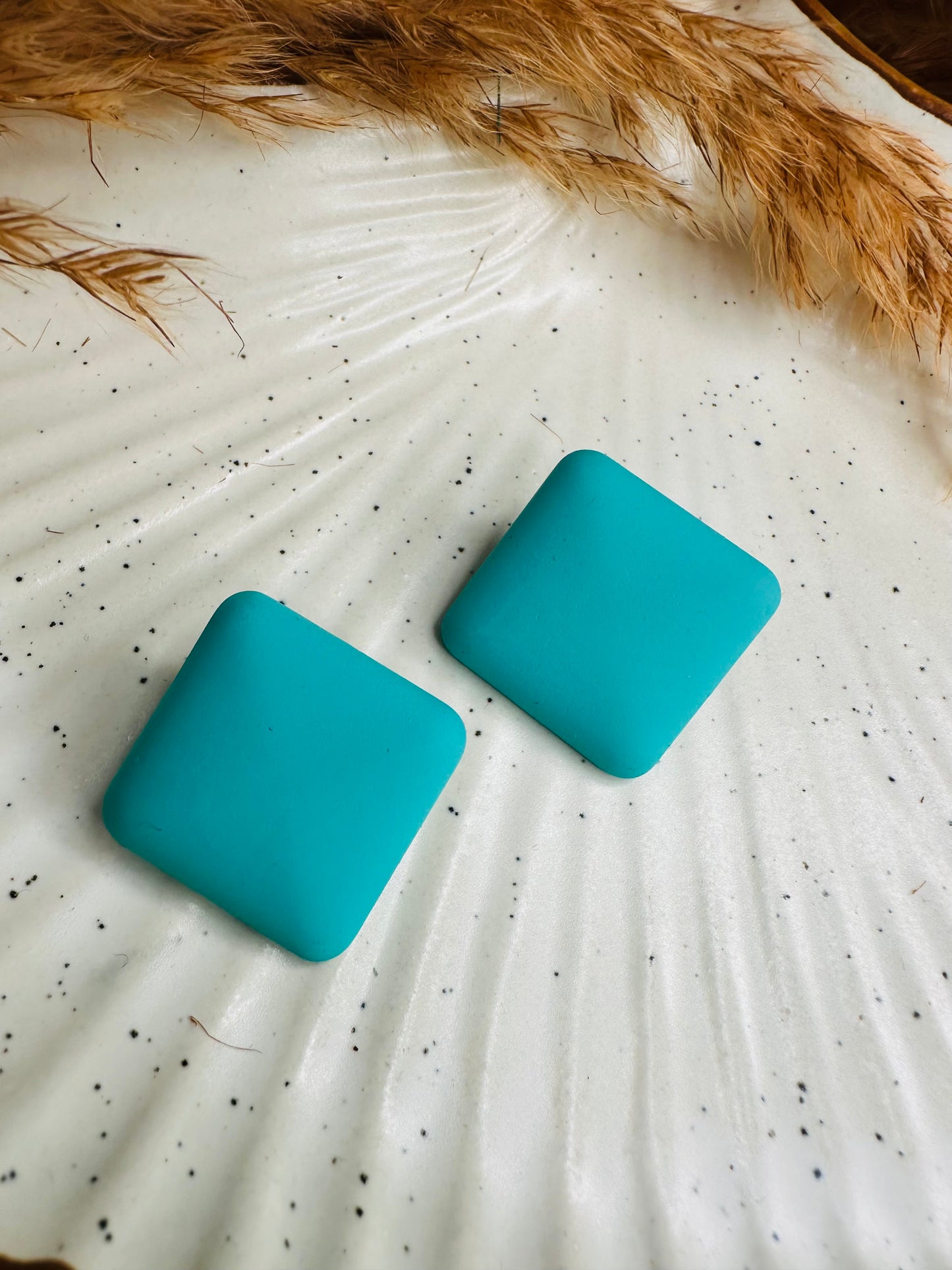 Detailed Shot Highlighting HeyBae Quirky Square Earrings with Bold Shape