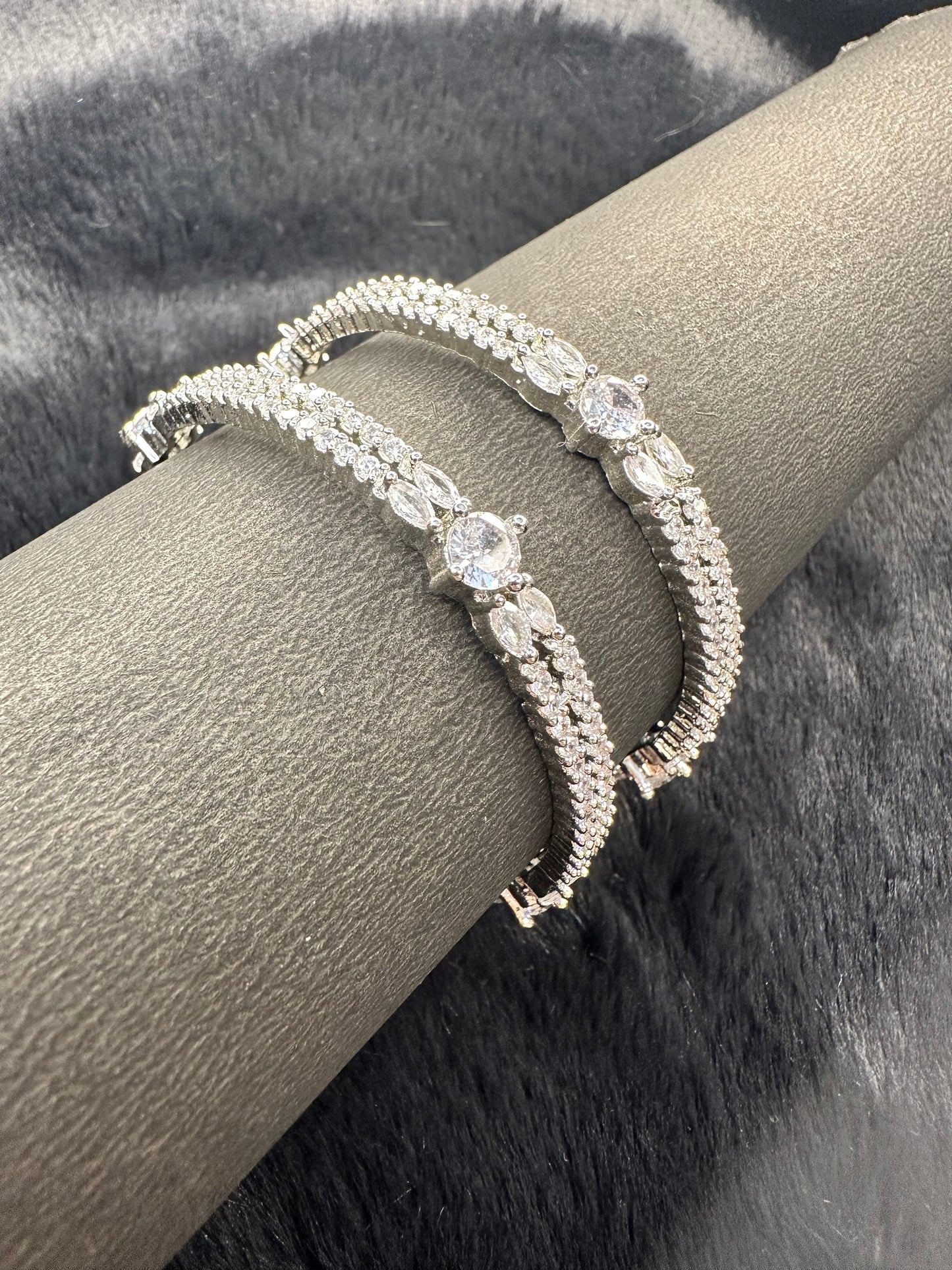 Detailed carvings and stones on HeyBae silver bangle