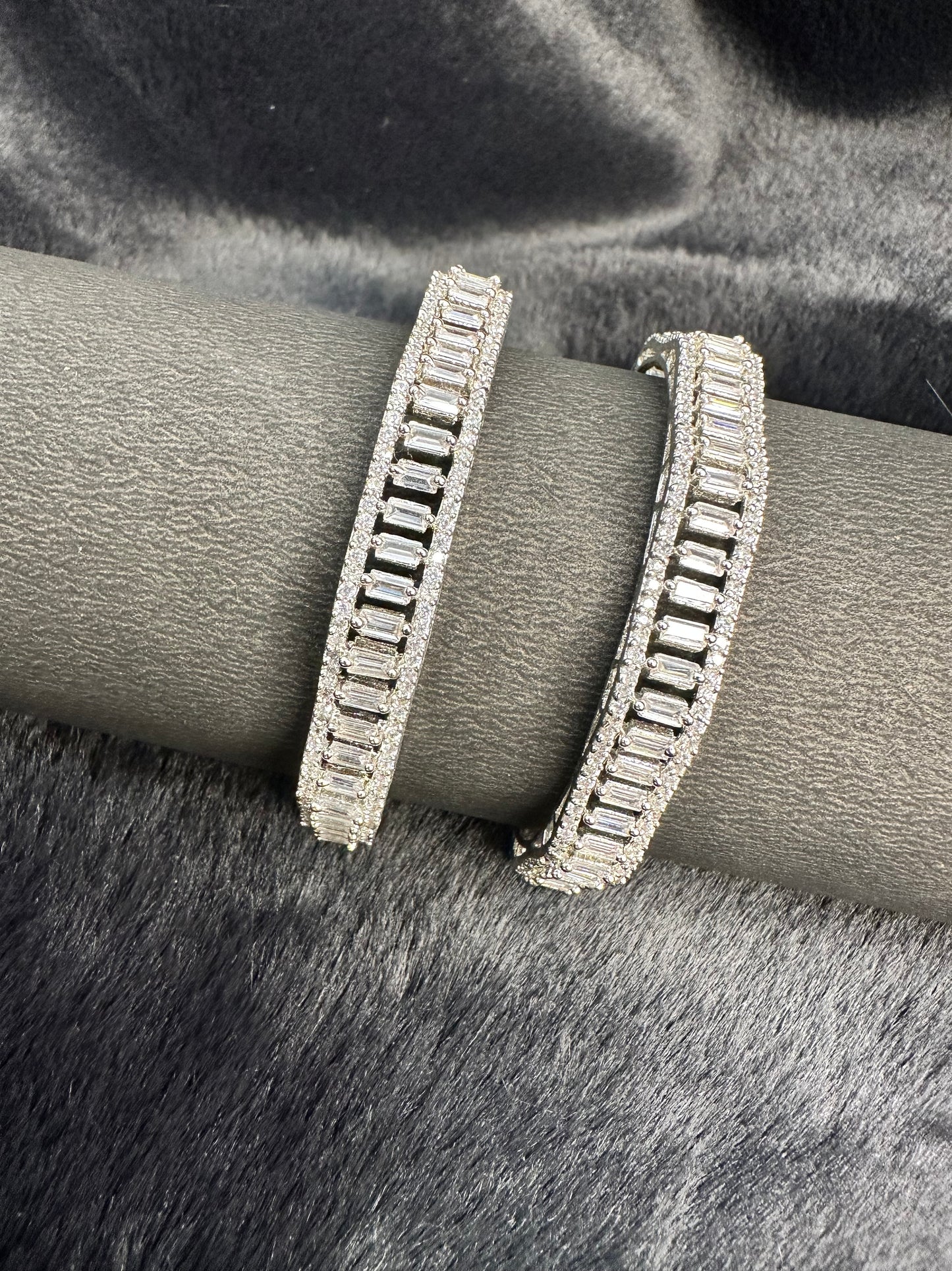 Flat lay of HeyBae Sparkling AD Bangle with American Diamond shine on fabric background