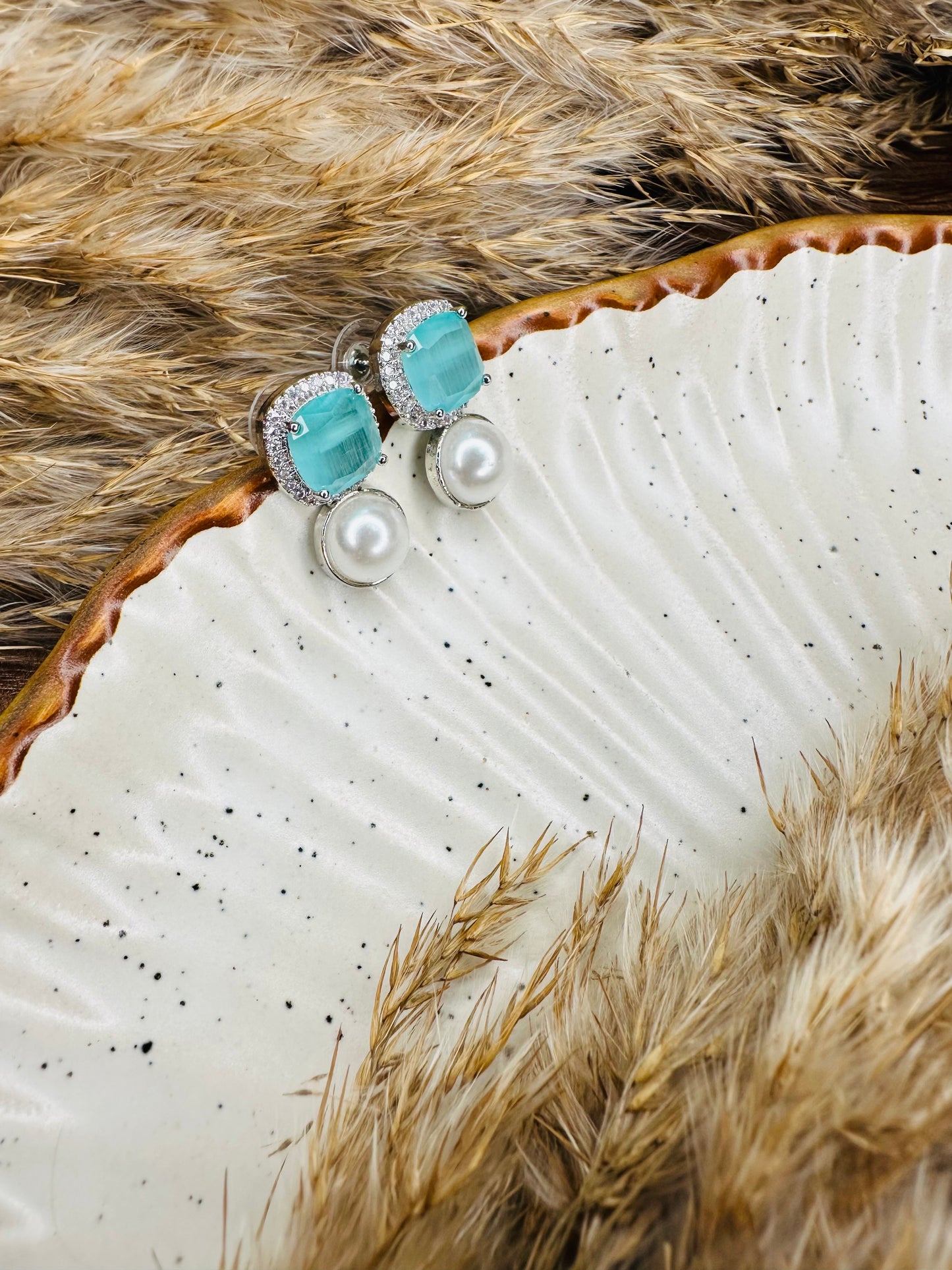 Side look of HeyBae Elegant AD Stud Earrings with pearl and stone