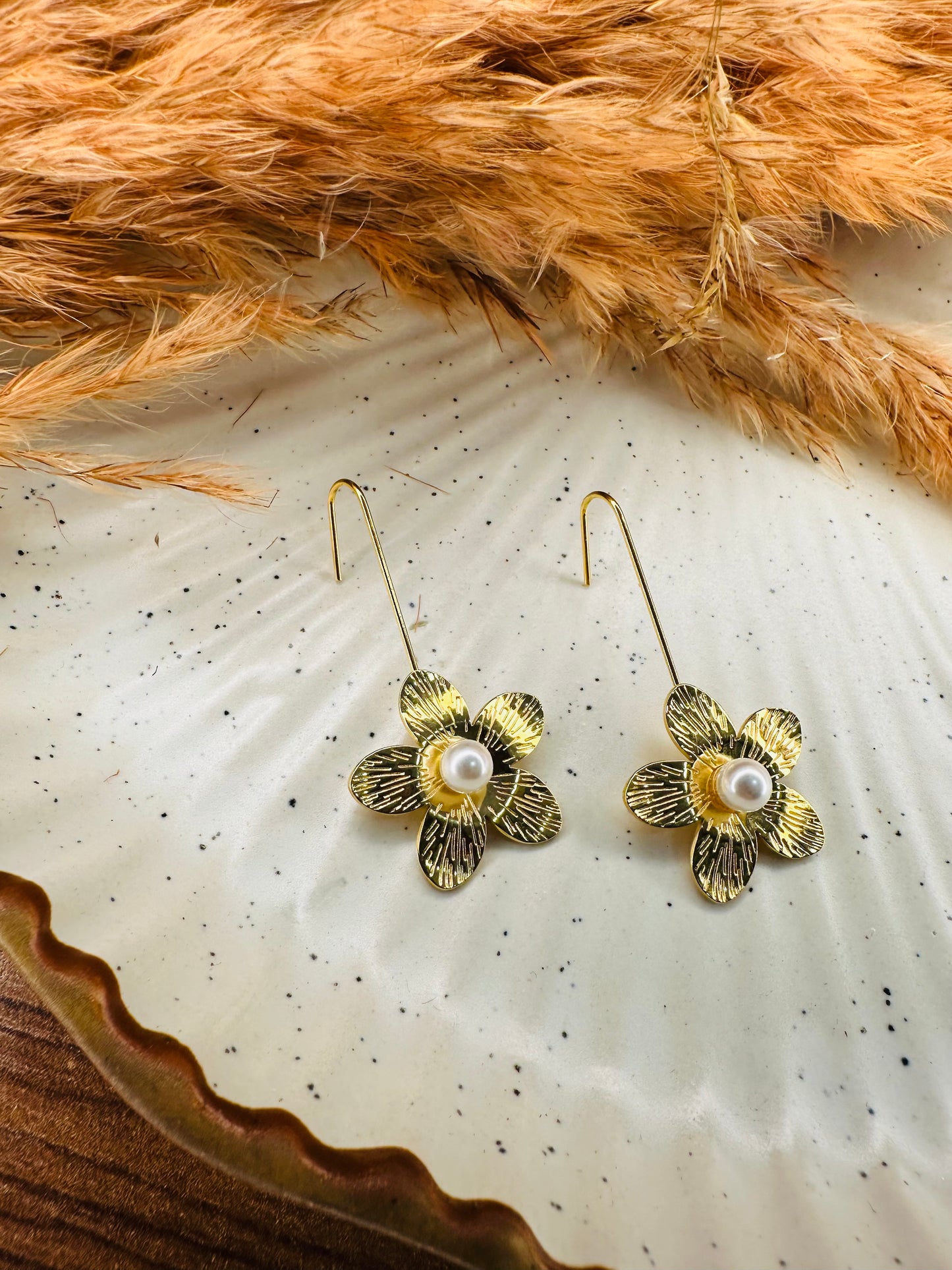 Side View of HeyBae Sleek Gold-Plated Teardrop Flower Earrings