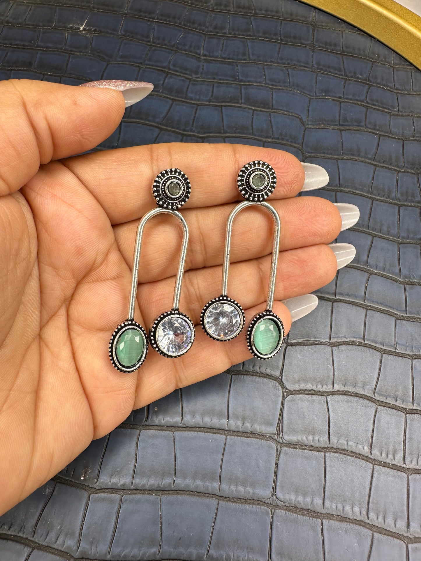 Side Angle of HeyBae Oxidised Earrings with Traditional Silver Design