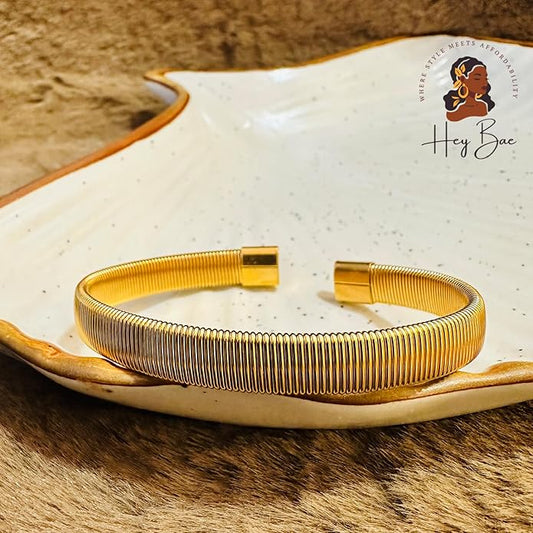 Women’s ribbed Kada bangle in stainless steel with gold finish