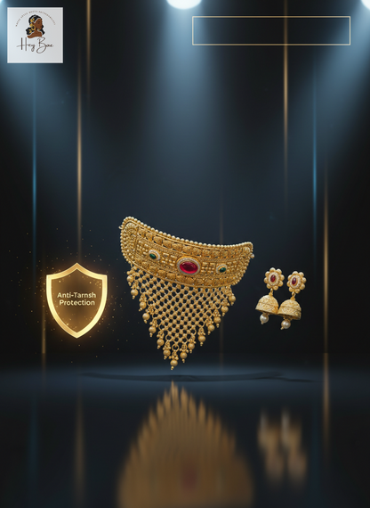 Gold necklace and earrings with 'Anti-Tarnish Protection' label on a dark background