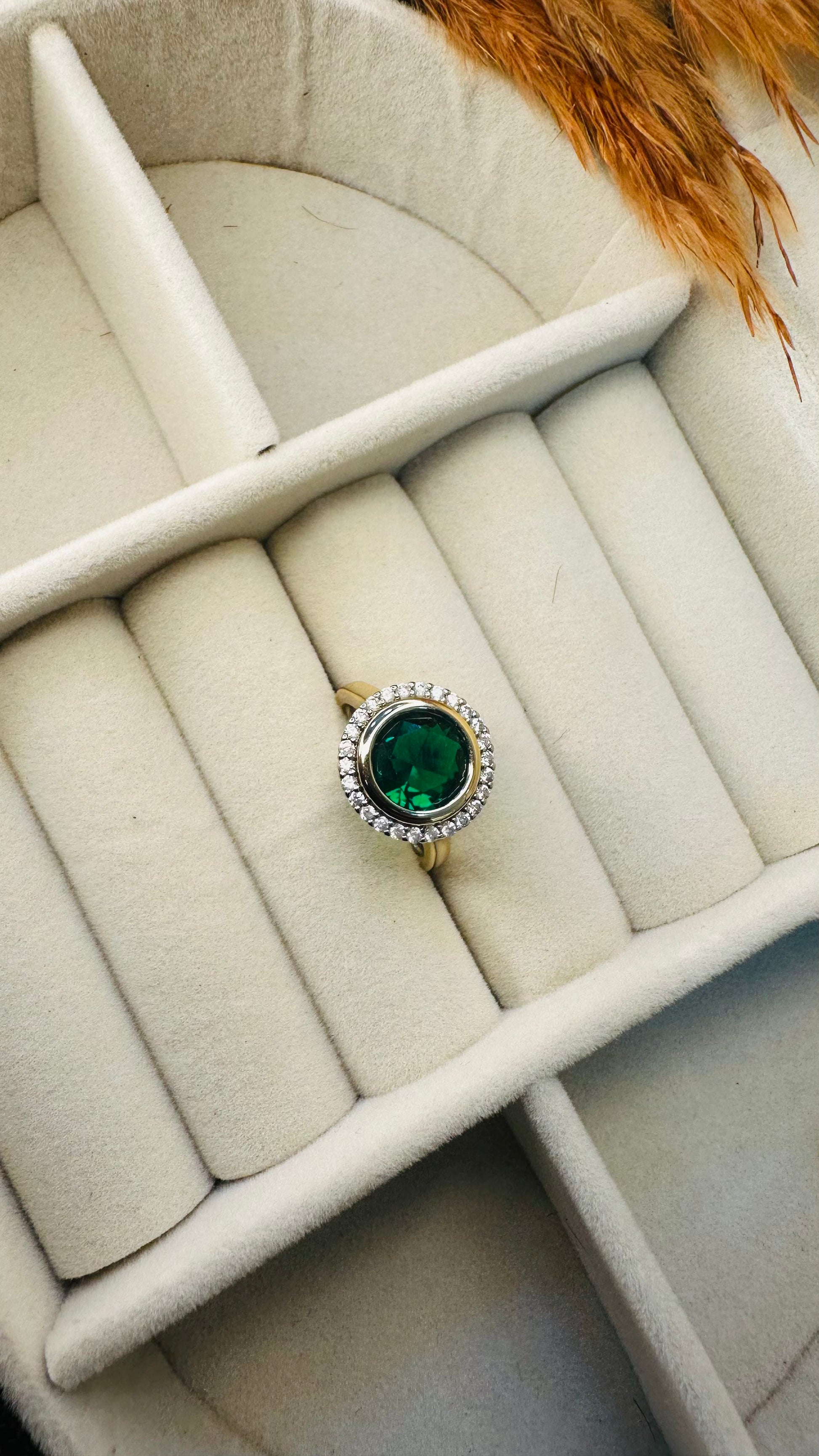 Women’s emerald gold-plated halo ring
