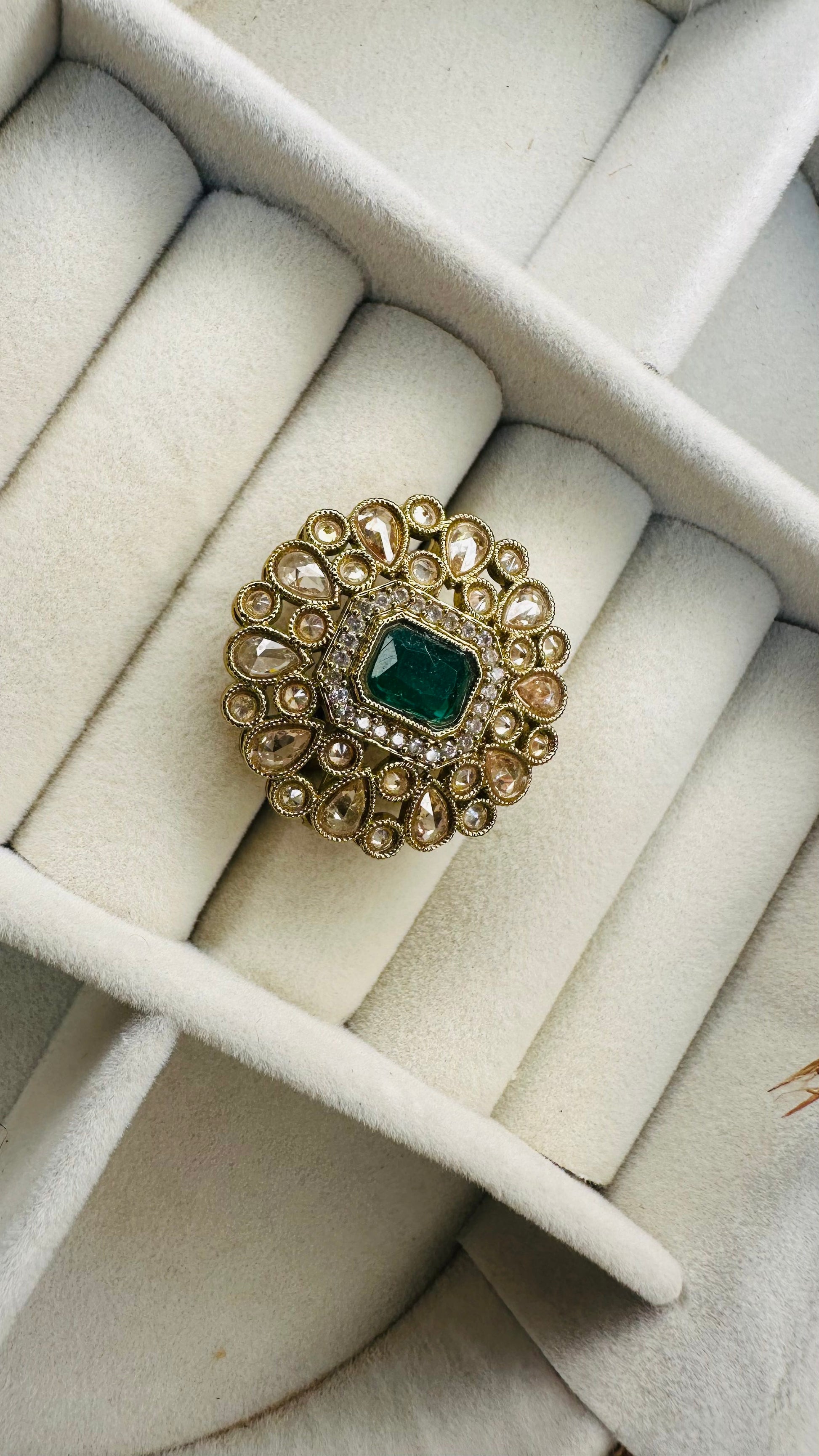 Closeup green gemstone polki kundan cocktail ring