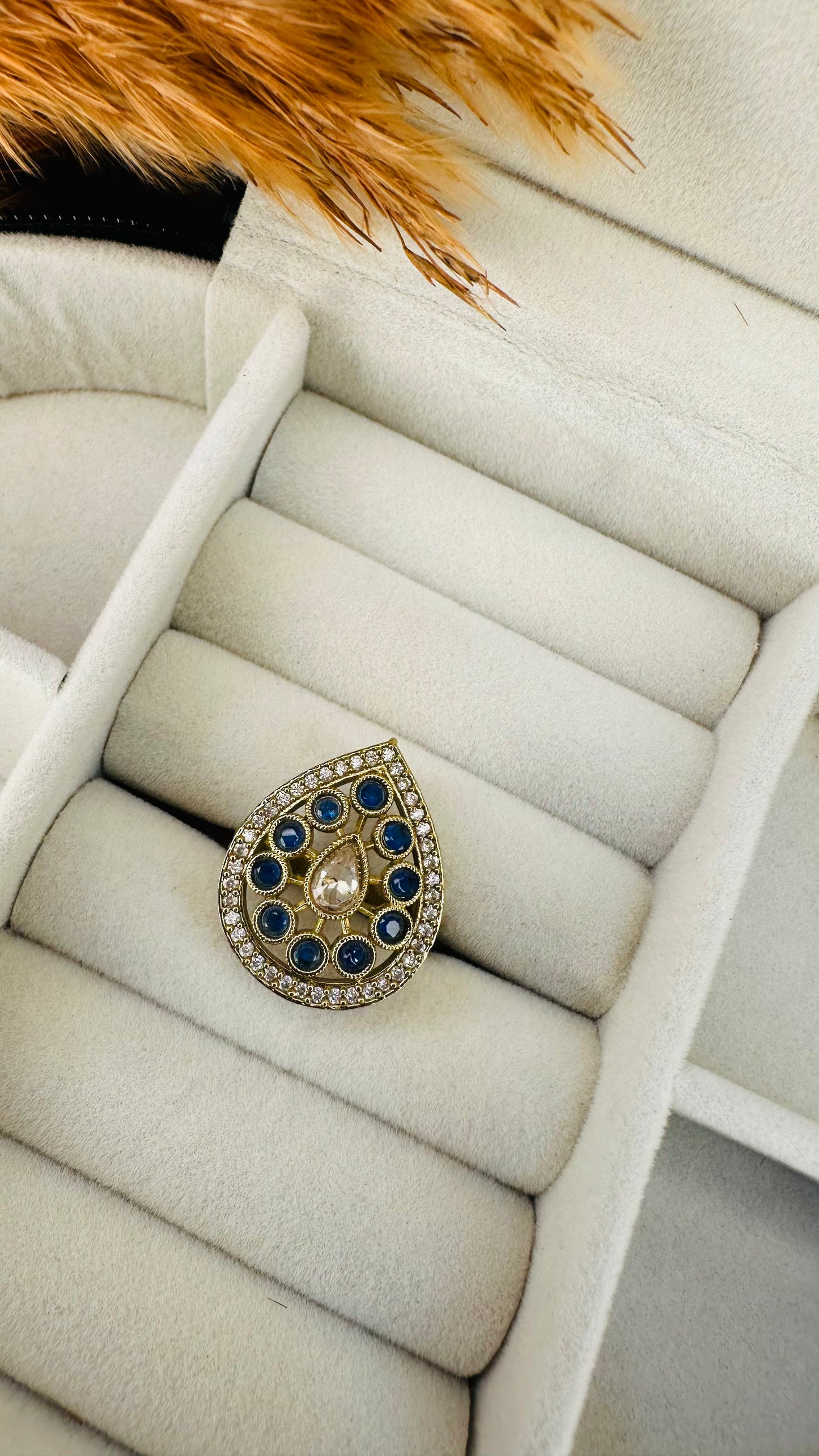 Closeup teardrop navy blue kundan ring