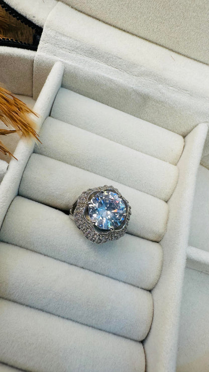 Prong-set large solitaire with pave halo ring