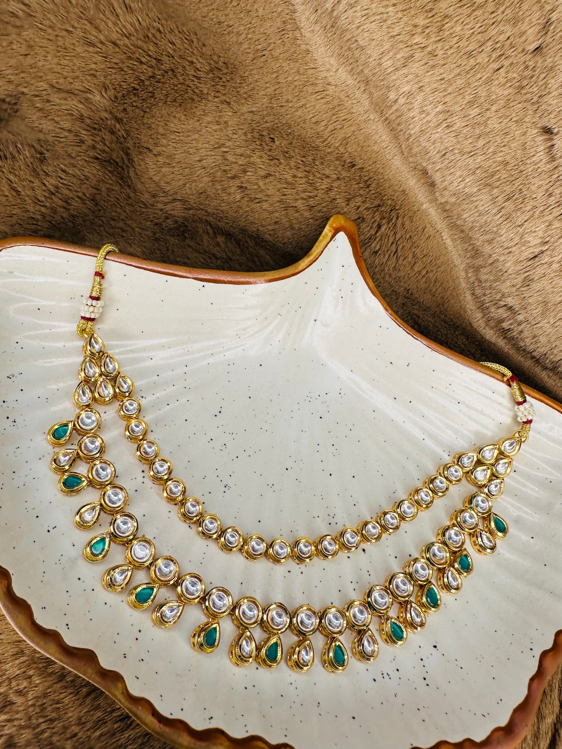 Necklace closeup green & kundan stones