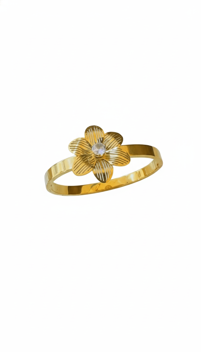 Gold flower-shaped bracelet with a central gemstone on a white background