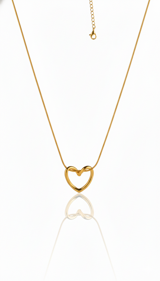 Gold heart-shaped pendent on a white background