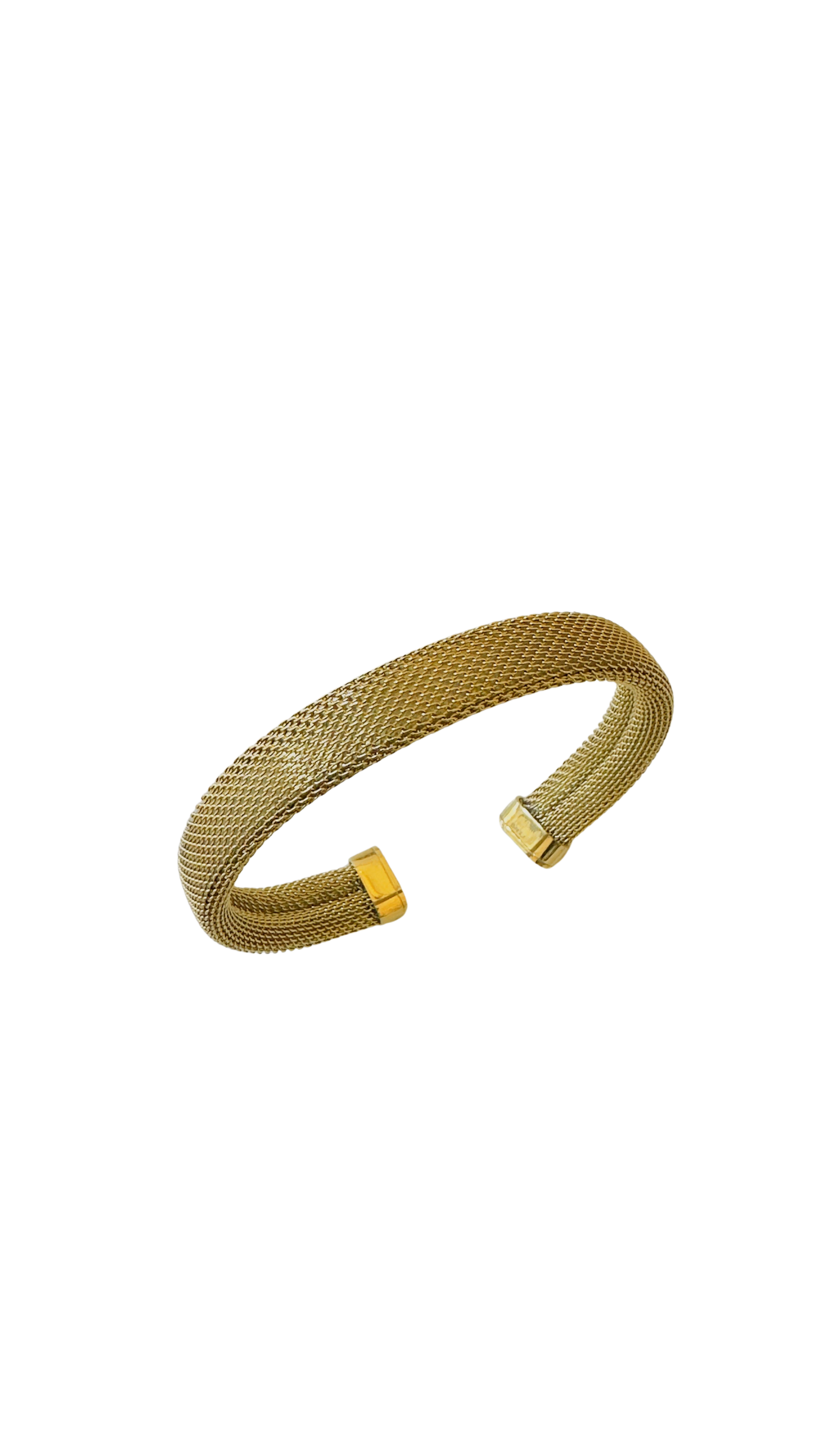 Gold mesh bracelet on a white background