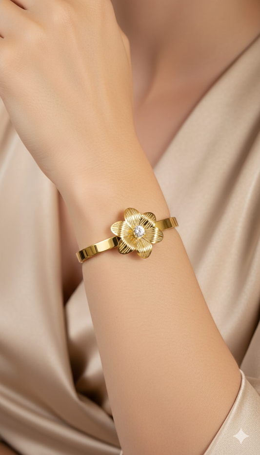 Gold plated anti tarnish  bracelet with a American diamond on a wrist against a soft beige background