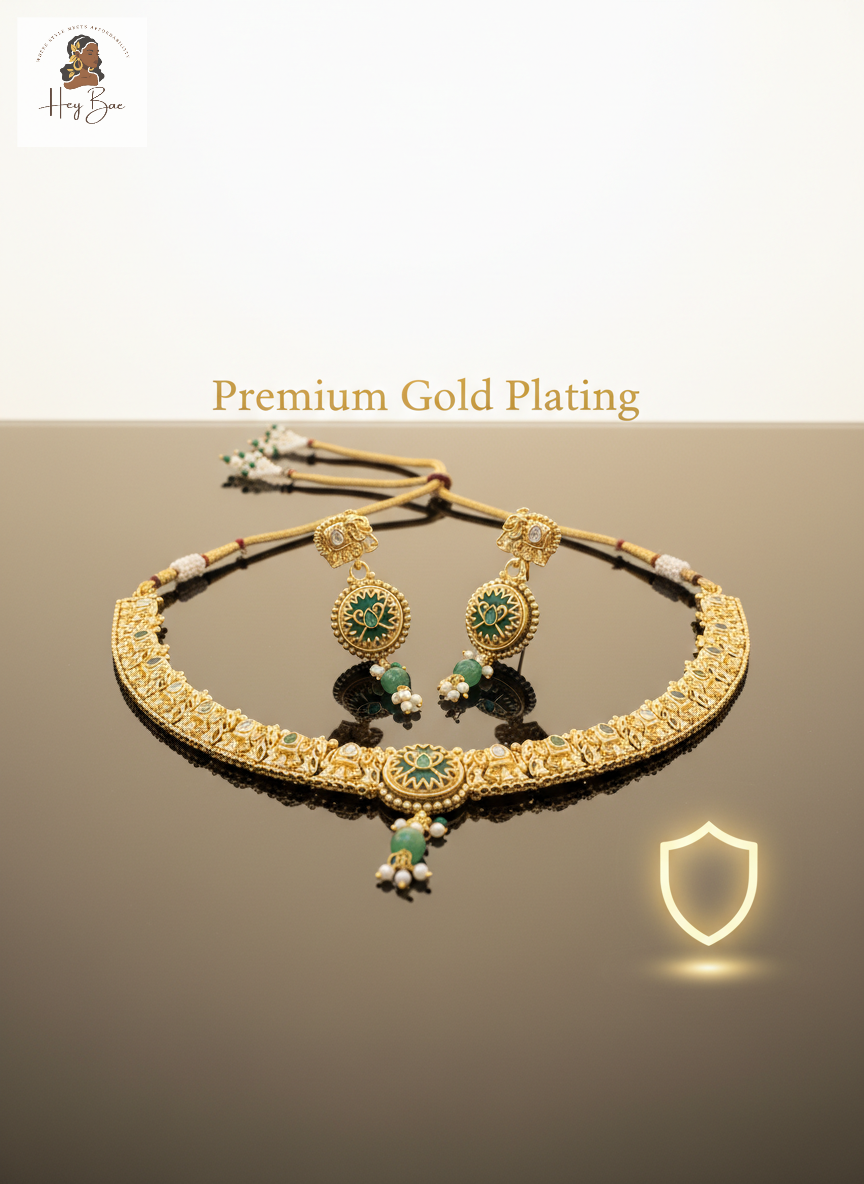 Gold necklace and earrings set with green gemstones on a brown background, featuring 'Premium Gold Plating' text.
