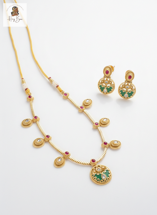 Hey Bae gold plated necklace set with green meenakari and ruby stones on white background.
