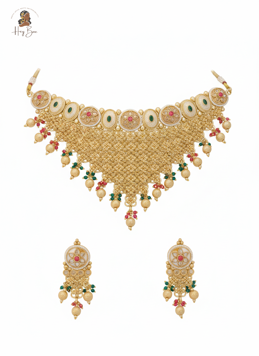Gold necklace with floral elements on a white background