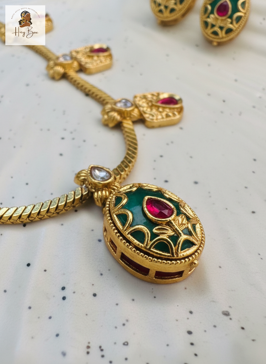  Hey Bae royal antique gold necklace set with ruby and green stones with green and red gemstones on a speckled surface