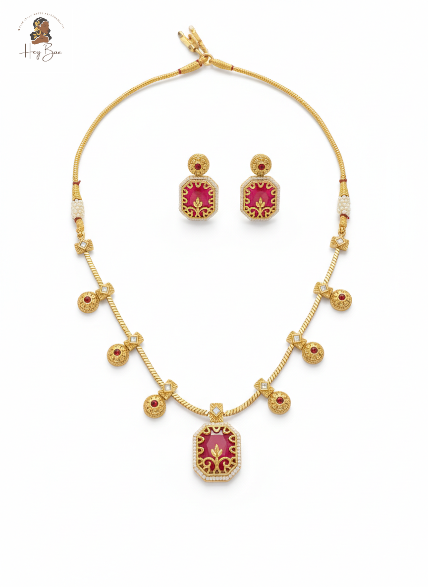 Hey Bae ruby red and gold geometric necklace set on white background