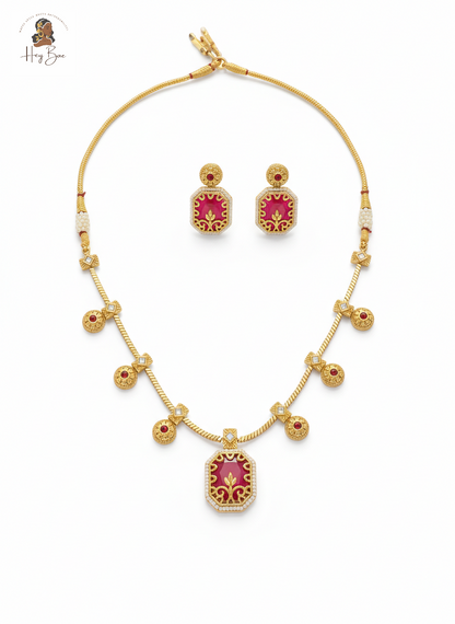 Hey Bae ruby red and gold geometric necklace set on white background
