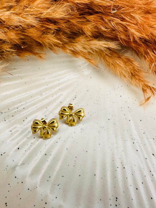 Stylish gold bow stud earrings with premium finish by HeyBae