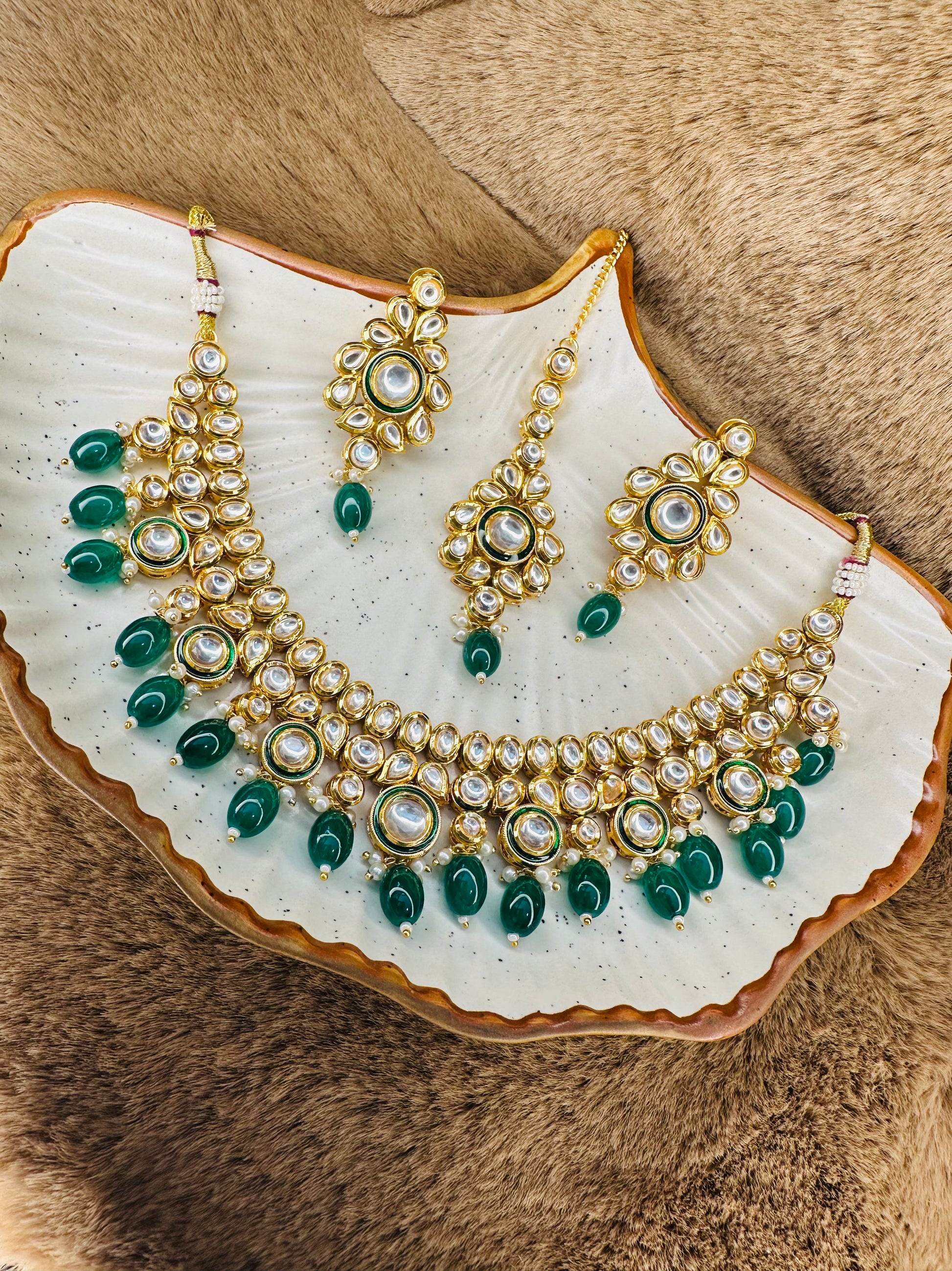 Kundan earrings & tikka closeup – green accents