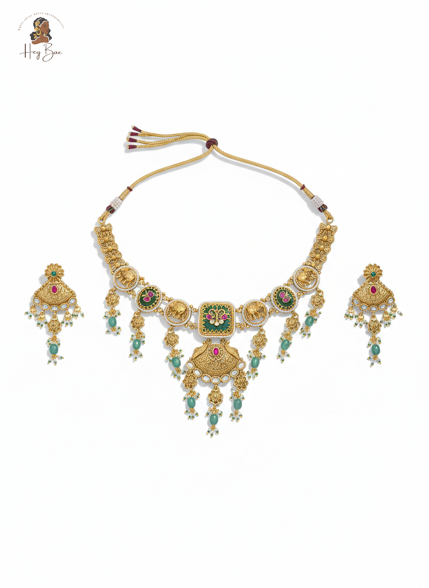 Royal antique gold choker necklace set with elephant motifs and green stones