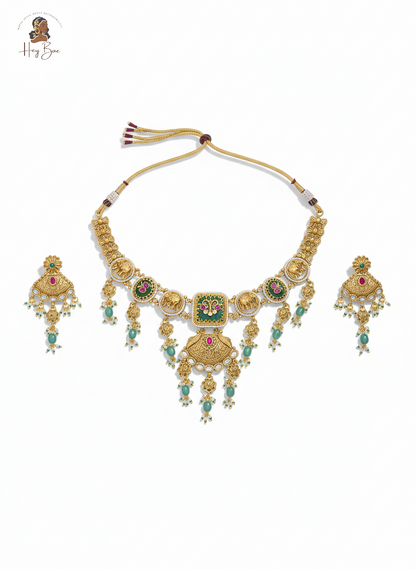 Royal antique gold choker necklace set with elephant motifs and green stones
