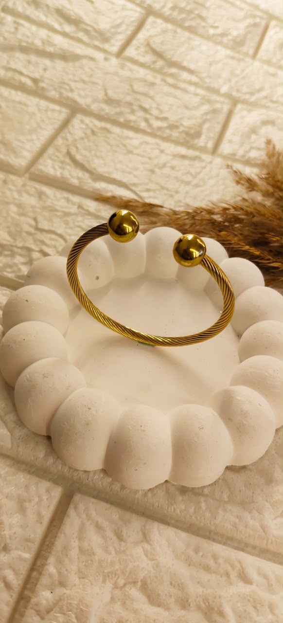 Golden Twist Orb Cuff Bangle