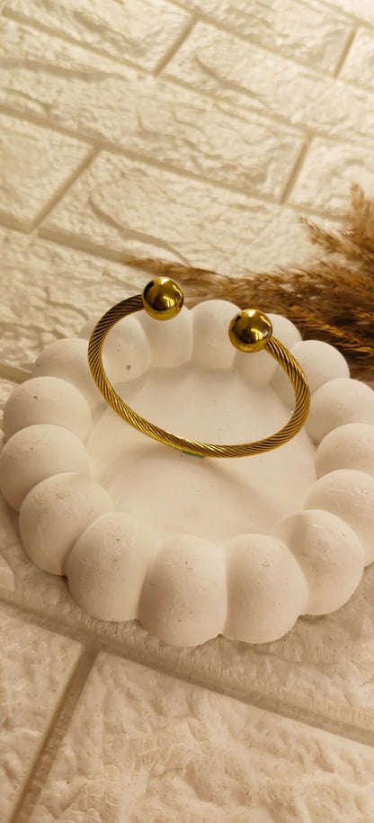 Golden Twist Orb Cuff Bangle