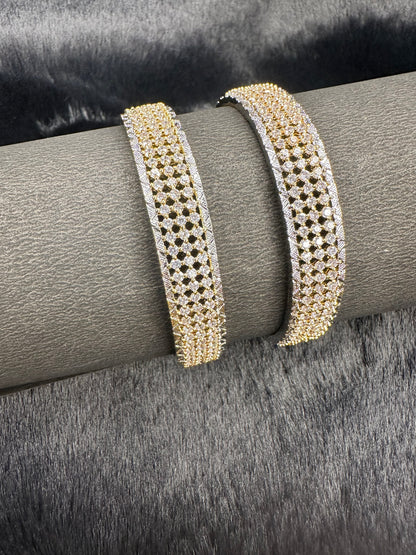 Flat lay of HeyBae Gold AD Designer Bangles with sparkling American Diamonds on fabric background