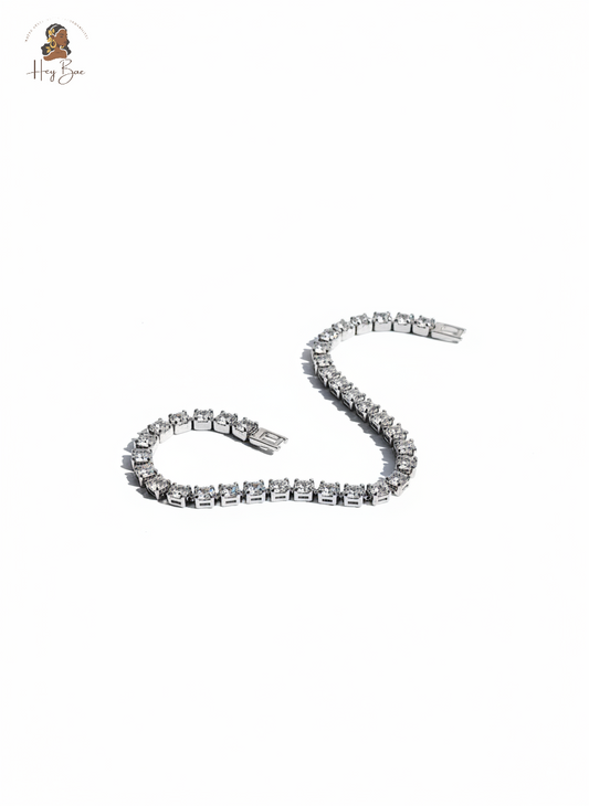 Silver bracelet with clear stones on a white background