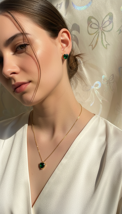 Woman wearing a heart  pendant and earrings with a decorative background