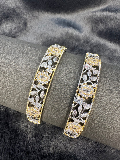 Flat lay of HeyBae AD bangles set on decorative cloth