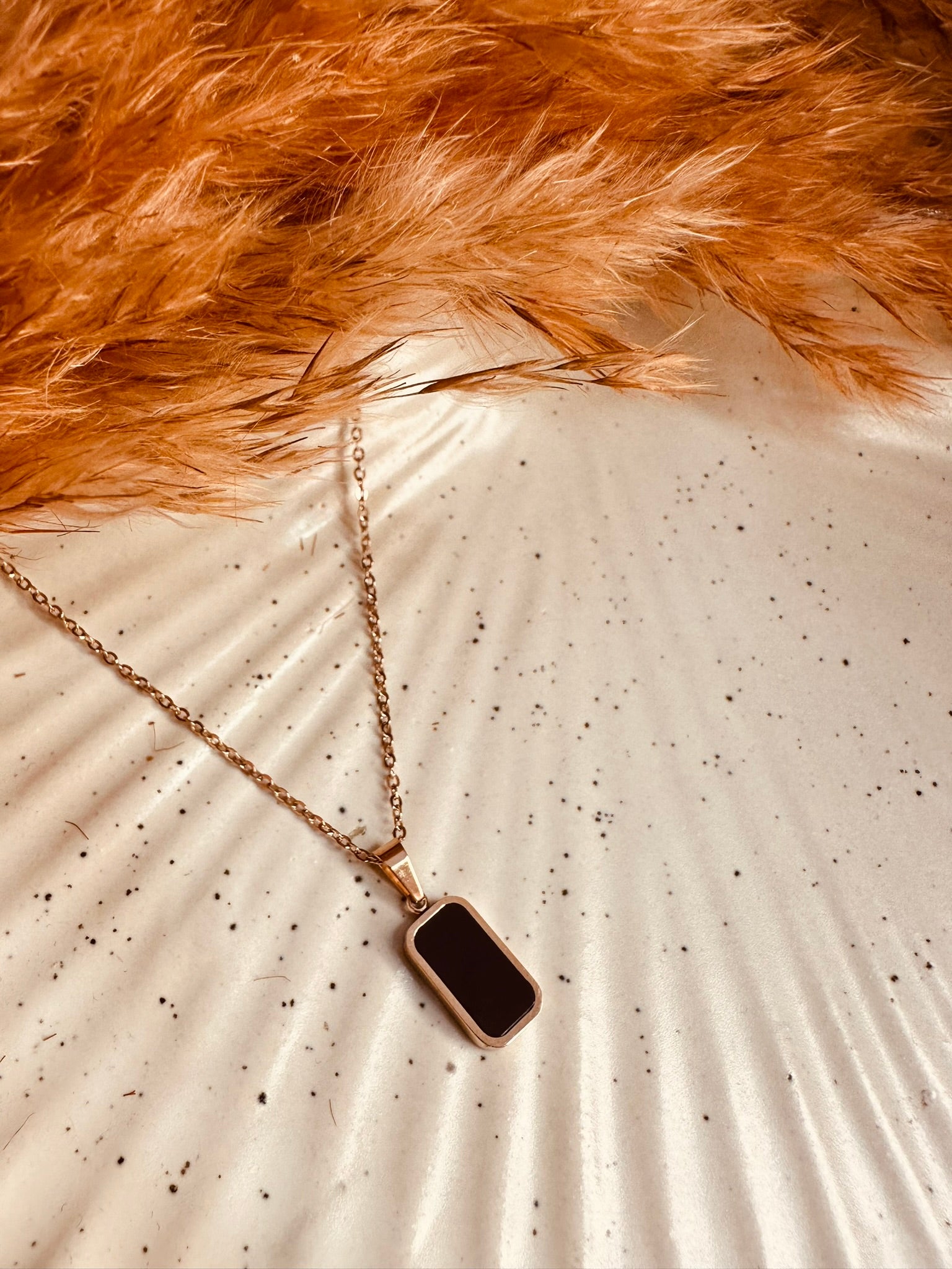 Flatlay display of HeyBae Bar Pendant & Chain Necklace for Women